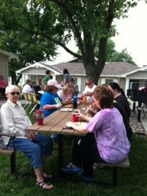 Group of seniors at a picnic table